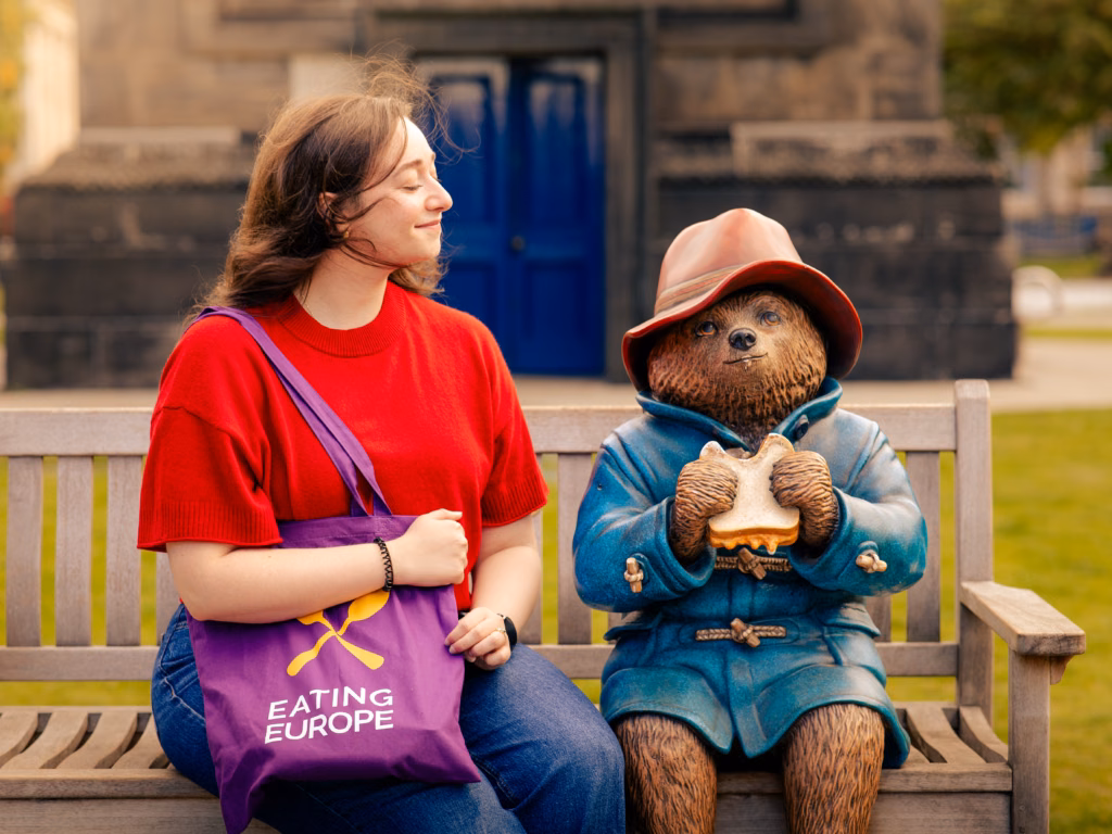 Our guide posing with the Paddington statue in Edinburgh