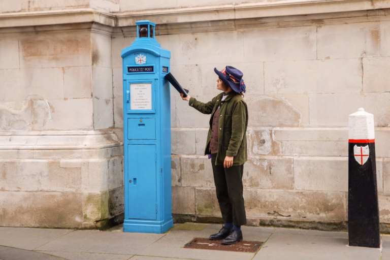 A guide explaining a police post/checkpoint to a group